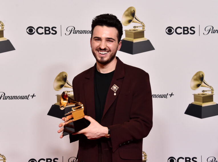 Blake Slatkin poses with the Record of the Year Award for