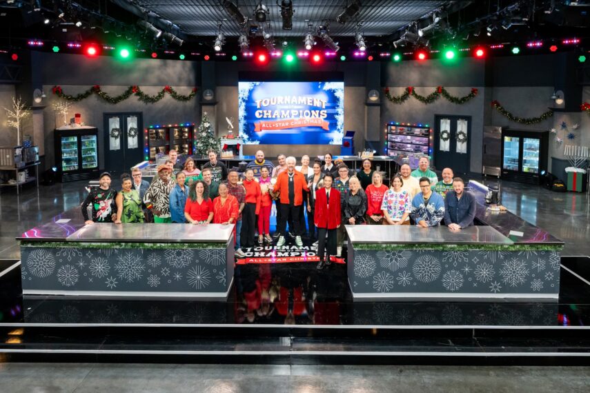 Host Guy Fieri with contestants Adam Sobel, Christian Petroni, Mei Lin, Nini Nguyen, Amanda Freitag, Aaron Sanchez, Jet Tila, Ashley Holt, Alex Guarnaschelli, Antonia Lofaso, Aarti Sequeira, Crista Luedtke, Jonathan Sawyer, Zac Young, Britt Rescigno, Sara Bradley, Damaris Phillips, Michael Voltaggio, Bryan Voltaggio, Maneet Chauhan, Stephanie Izard, Kevin Lee, Dale Talde, Shirley Chung, Sherry Yard, Marcel Vigneron, Tobias Dorzon, Marcus Samuelsson, Rachel Sherriffe, Graham Elliot, and Giuseppe Tentori, as seen on Tournament of Champions Holiday, Season 1.