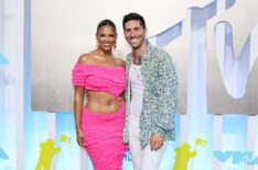 Kamie Crawford and Nev Schulman attend the 2022 MTV VMAs at Prudential Center