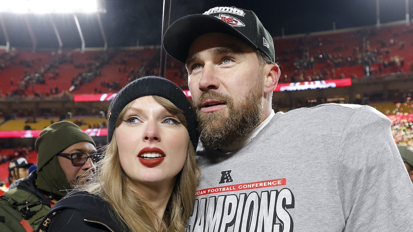 Taylor Swift celebrates with Travis Kelce #87 of the Kansas City Chiefs after defeating the Buffalo Bills
