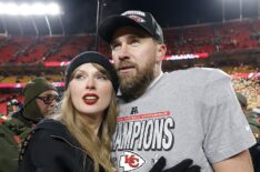 Taylor Swift celebrates with Travis Kelce #87 of the Kansas City Chiefs after defeating the Buffalo Bills