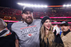 Taylor Swift celebrates with Travis Kelce #87 of the Kansas City Chiefs after defeating the Buffalo Bills