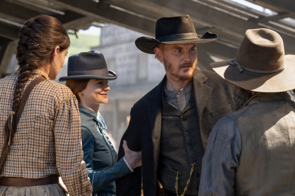 Diana Silvers as Dahlia Teller, Aisling Franciosi as Trisha Van Ness, and Toby Hemingway as Willem Van Ness in 'The Abandons' Season 1 Episode 1