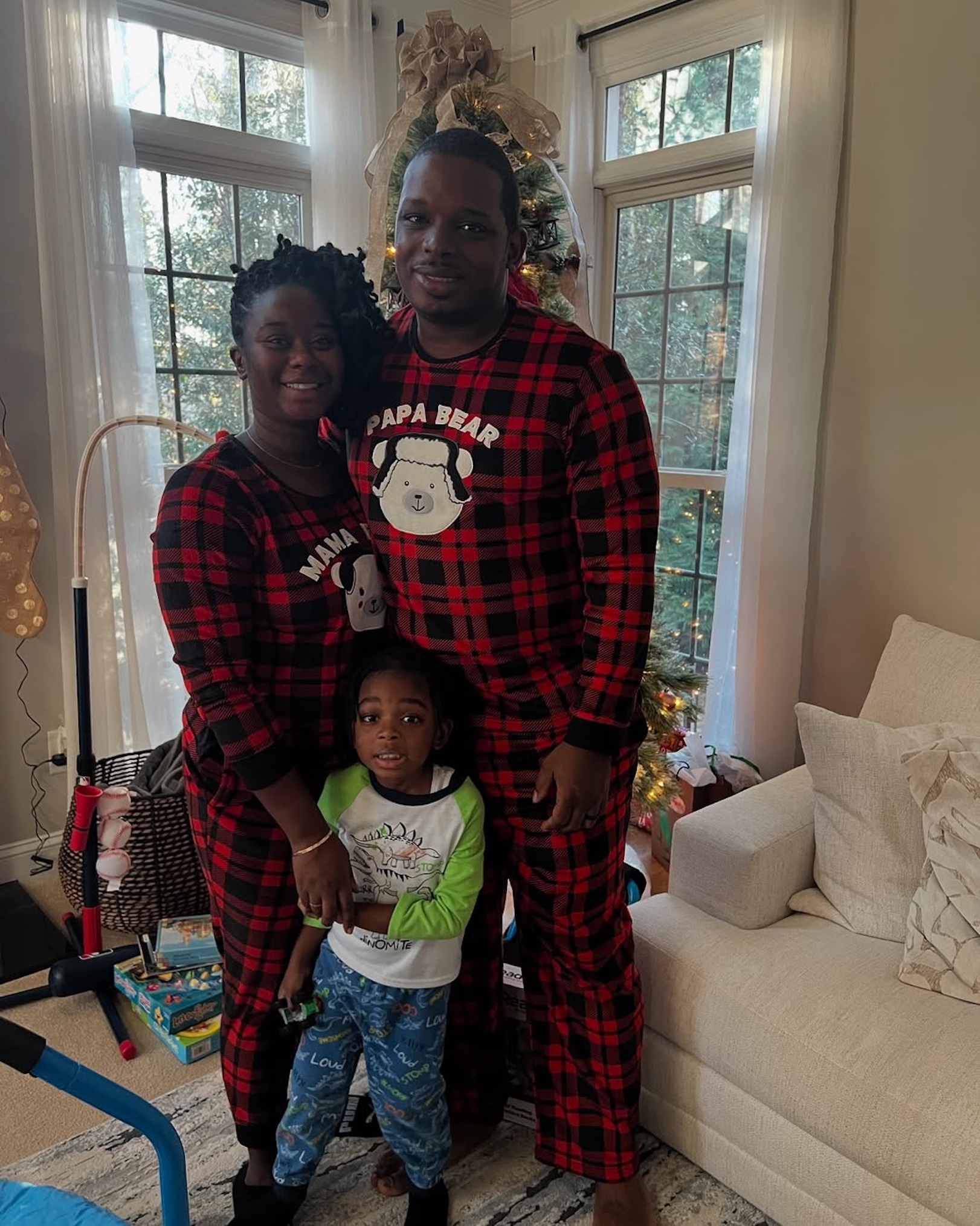 Deonna McNeill and Greg Okotie and their child