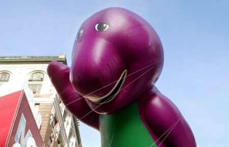 NEW YORK - NOVEMBER 28: The Barney balloon is carried past Macy's department store during the 76th annual Macy's Thanksgiving Day Parade November 28, 2002 in New York City. There were a total of 13 giant character balloons in the parade. (Photo by Mario Tama/Getty Images)