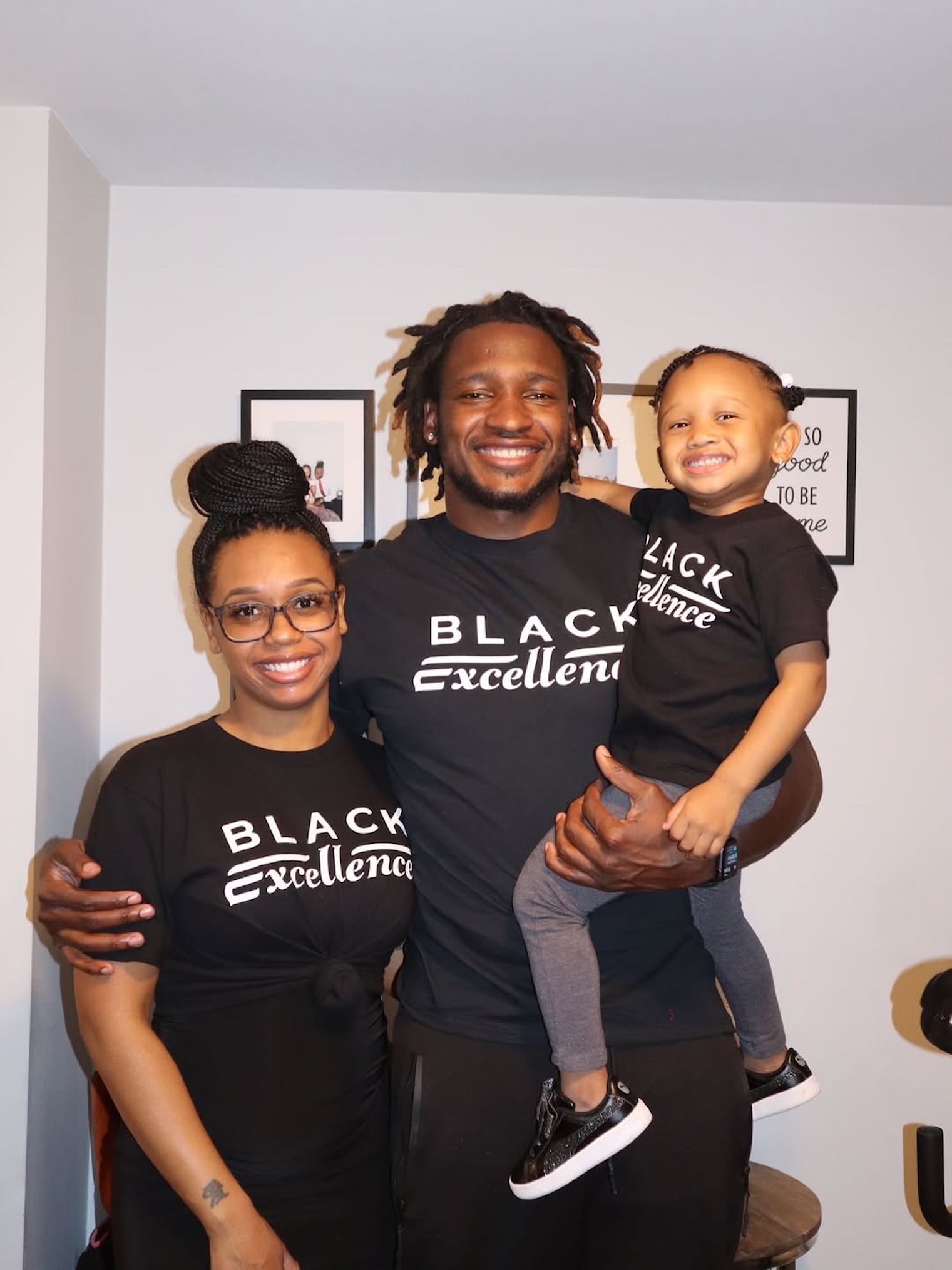 Jephte Pierre, Shawniece Jackson, and kid