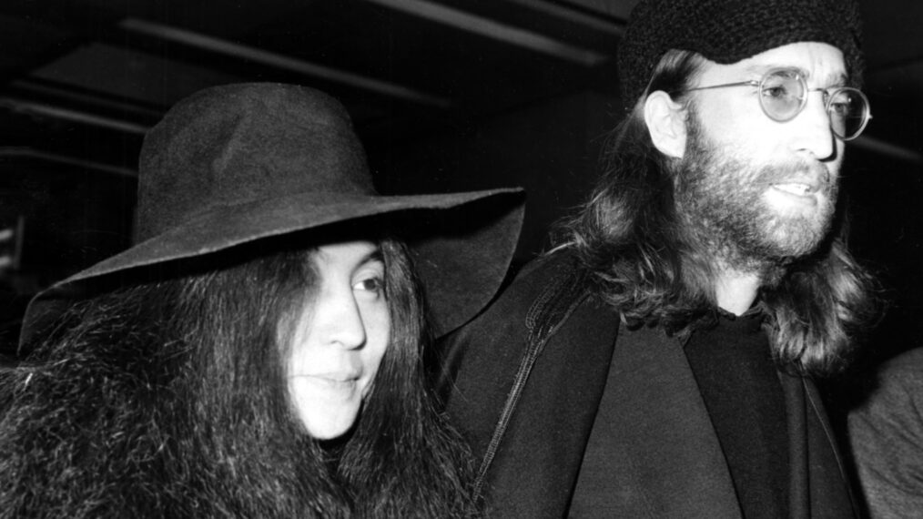John Lennon, with Yoko Ono at London's Heathrow Airport ca. 1969