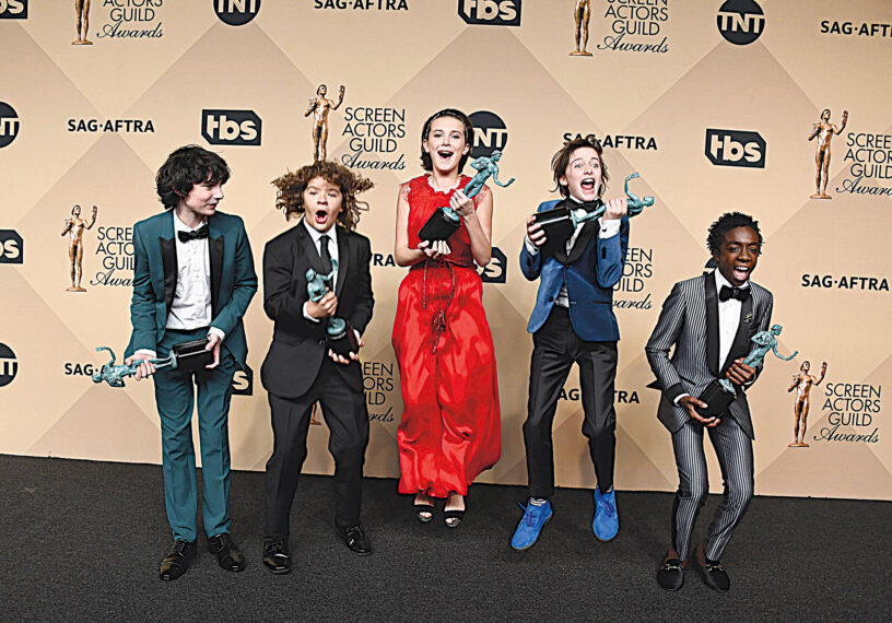 Stranger Than Fiction (L-R) Actors Finn Wolfhard, Gaten Matarazzo, Millie Bobby Brown, Noah Schnapp, and Caleb McLaughlin, co-recipients of the Outstanding Performance by an Ensemble in a Drama Series award for 'Stranger Things,' pose in the press room during The 23rd Annual Screen Actors Guild Awards at The Shrine Auditorium on January 29, 2017 in Los Angeles, California."