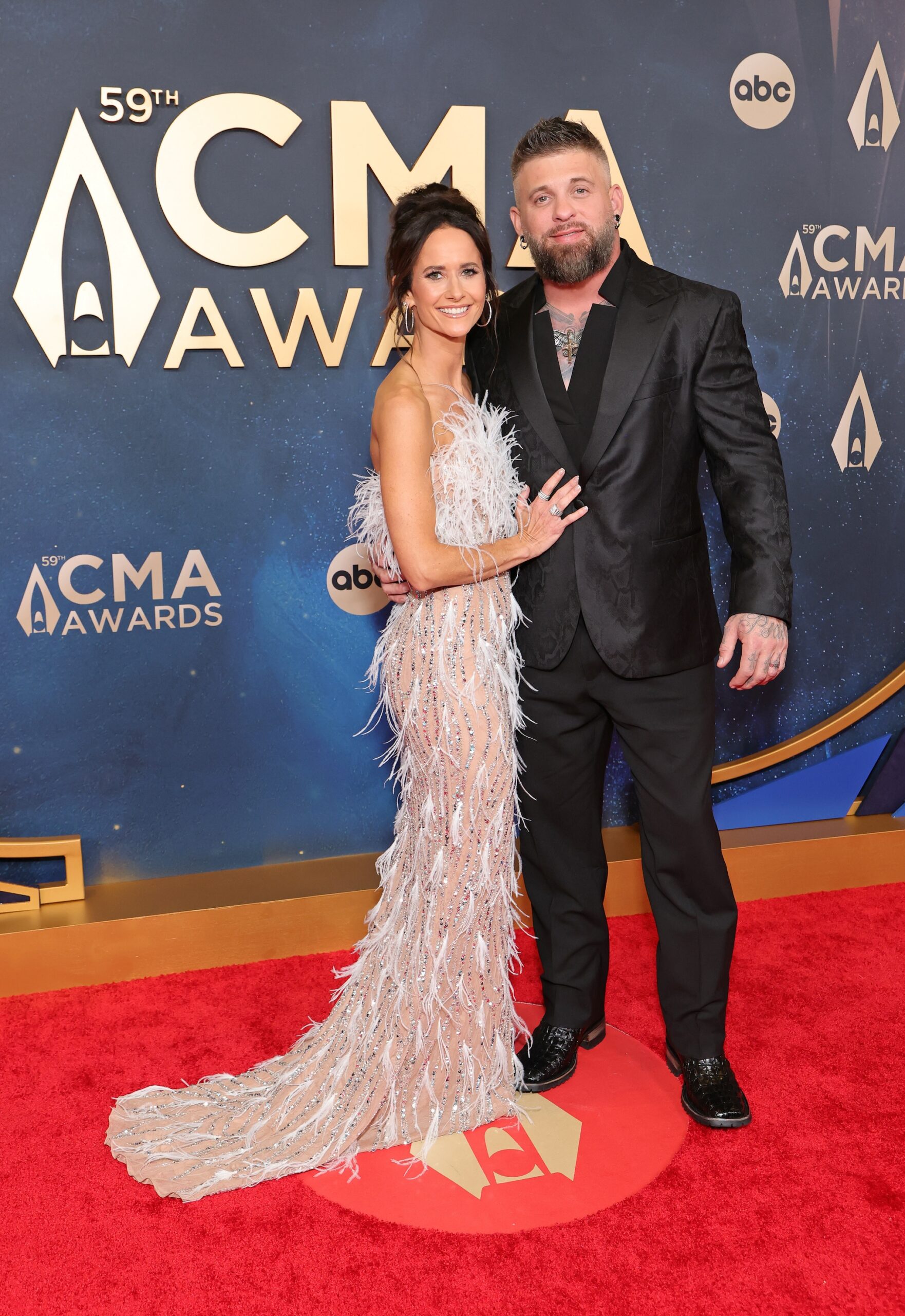 Amber Cochran Gilbert and Brantley Gilbert attend the 59th Annual CMA Awards