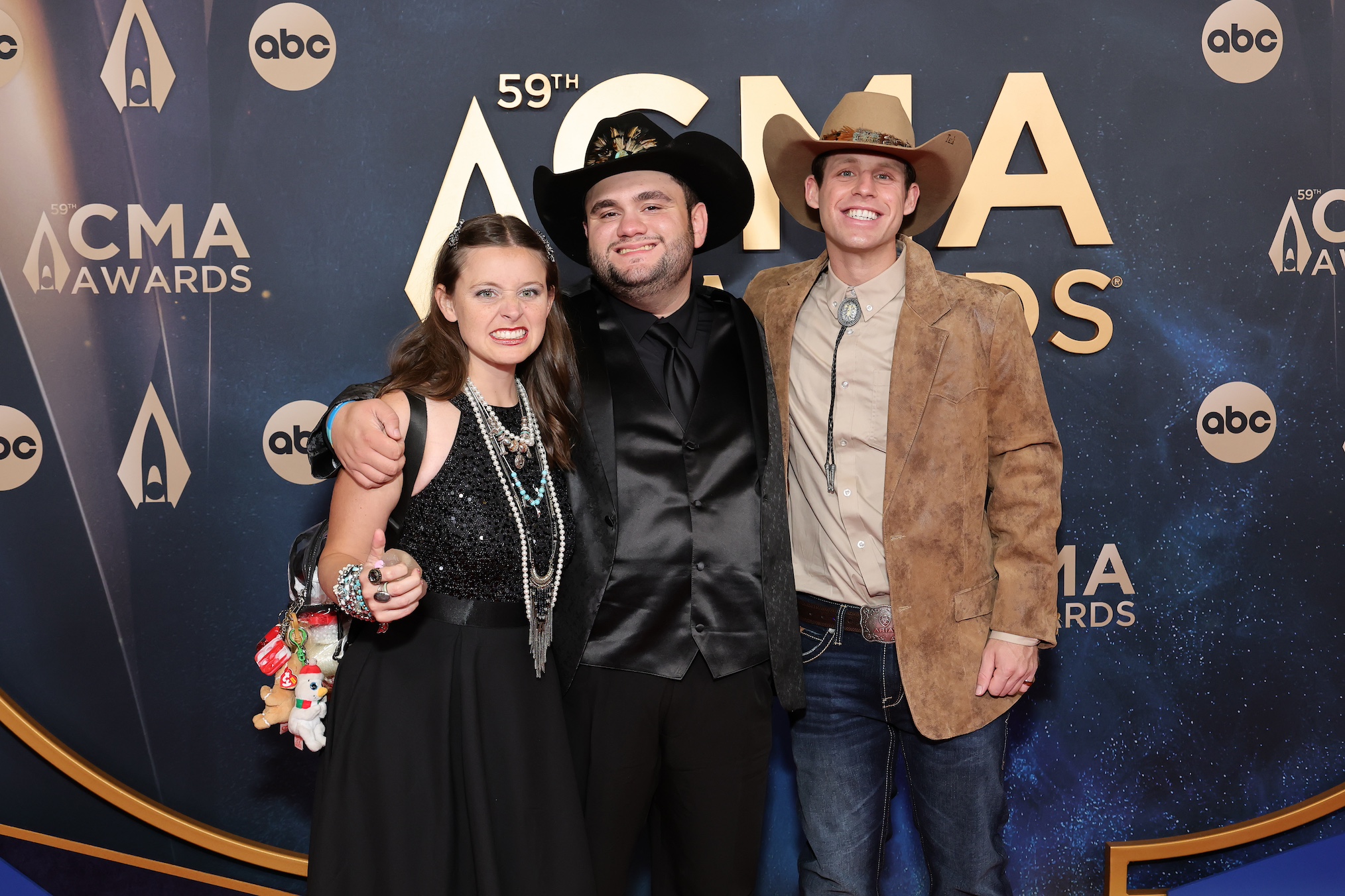 Madison Marilla, Tyler White and Tanner Smith attend the 59th Annual CMA Awards at Music City Center on November 19, 2025
