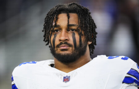Marshawn Kneeland #94 of the Dallas Cowboys looks on from the sideline during the national anthem prior to an NFL football game against the Tampa Bay Buccaneers at AT&T Stadium on December 22, 2024 in Arlington, Texas.