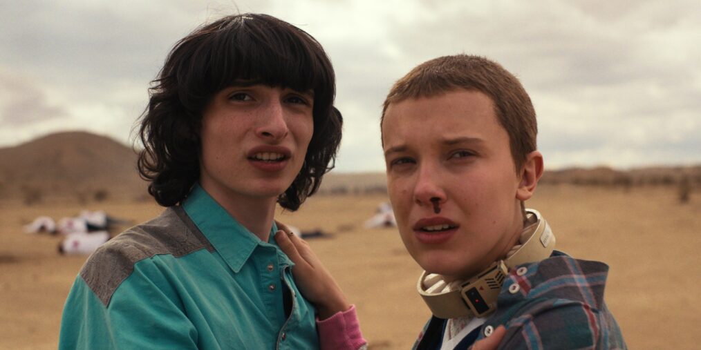 Finn Wolfhard as Mike Wheeler and Millie Bobby Brown as Eleven in STRANGER THINGS.