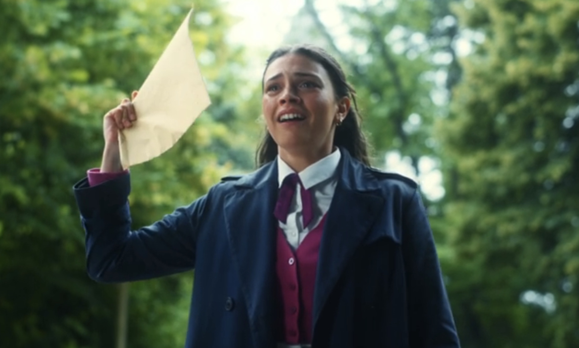 Ruby holds up her scholarship exam application in 'Maxton Hall' Season 2 Episode 5