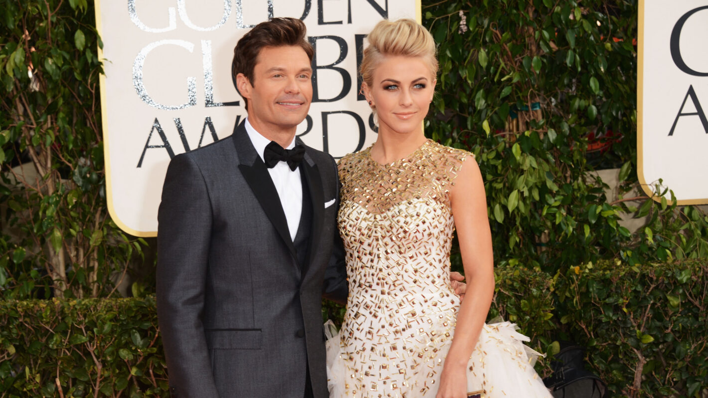 TV personality Ryan Seacrest (L) and dancer Julianne Hough arrive at the 70th Annual Golden Globe Awards