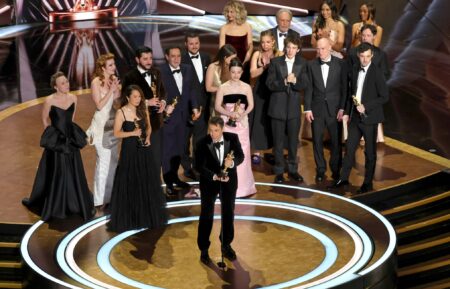 Cast and crew including Darya Ekamasova, Lindsey Normington, Vache Tovmasyan, Karren Karagulian, Alex Coco, Mikey Madison, Mark Eydelshteyn, Samantha Quan, Luna Sofía Miranda, Sean Baker, Drew Daniels and Yura Borisov accept the Best Picture award for 