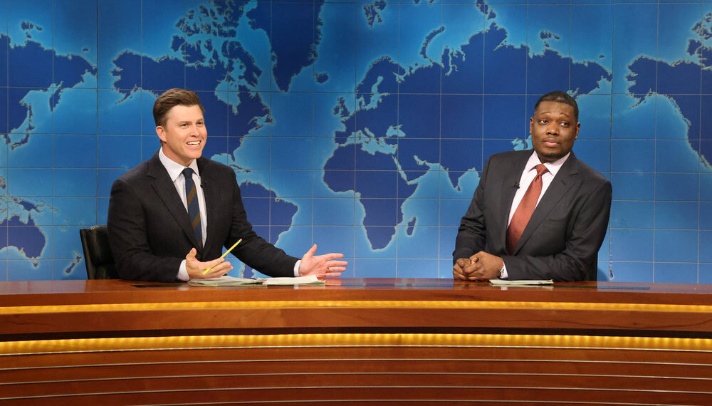 SATURDAY NIGHT LIVE -- Episode 1891 -- Pictured: (l-r) Anchor Colin Jost and anchor Michael Che during Weekend Update on Saturday, December 6, 2025 -- (Photo by: Will Heath/NBC)