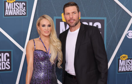 Carrie Underwood and Mike Fisher attend the 2022 CMT Music Awards at Nashville Municipal Auditorium