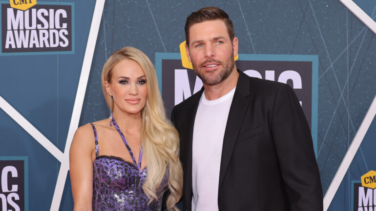 Carrie Underwood and Mike Fisher attend the 2022 CMT Music Awards at Nashville Municipal Auditorium