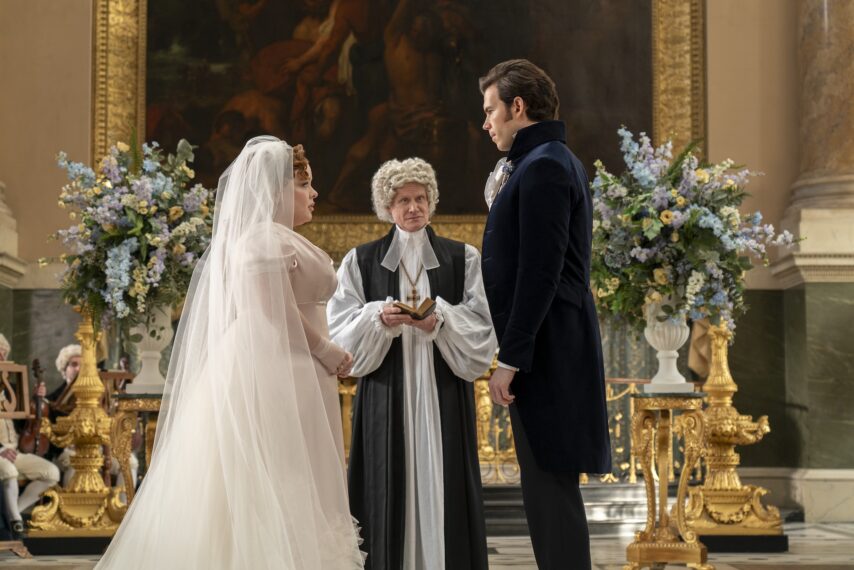 Nicola Coughlan as Penelope Featherington, James Duke as Minister Hughes, Luke Newton as Colin Bridgerton in episode 307 of Bridgerton