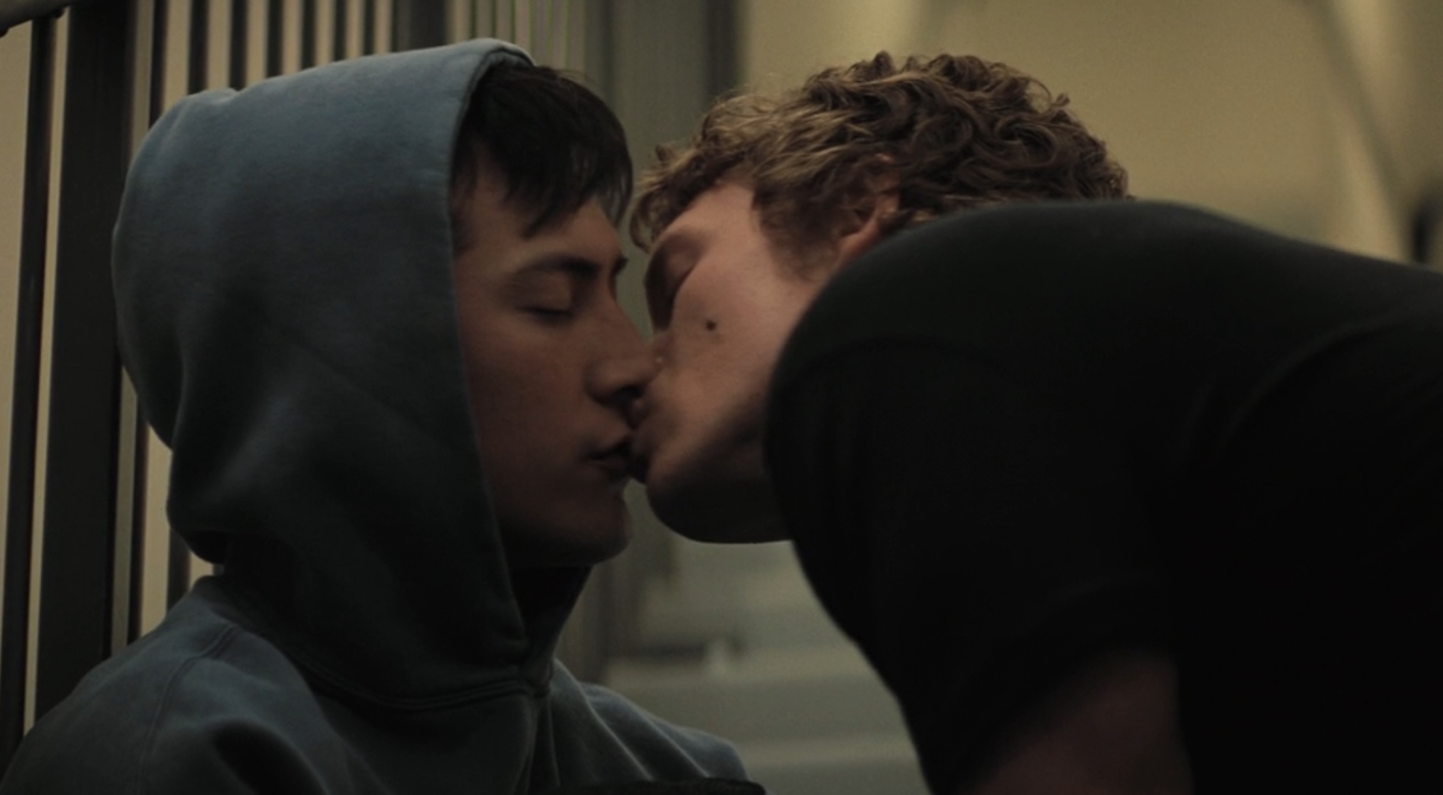 Shane and Ilya kiss in the stairwell in 'Heated Rivalry' Season 1