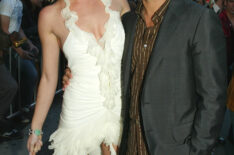 Actors Rebecca Romijn-Stamos (L) and her husband John Stamos arrive at the premiere of 'X2: X-MEN UNITED' at the Chinese Theatre on April 28, 2003 in Los Angeles, California