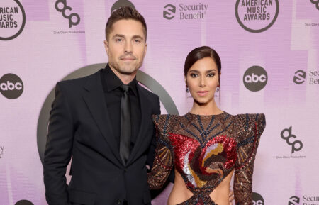 Eric Winter and Roselyn Sánchez attend the 2022 American Music Awards at Microsoft Theater on November 20, 2022