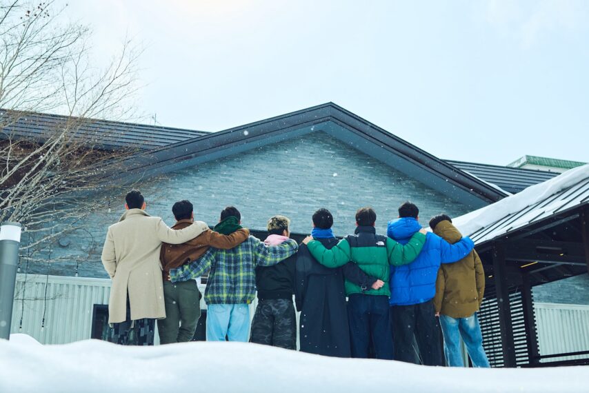 The boyfriend season 2 cast, facing away from the camera in a winter setting