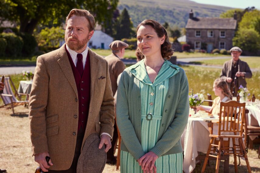 Samuel West as Siegfried Farnon and Anna Madeley as Mrs. Hall in All Creatures Great and Small.