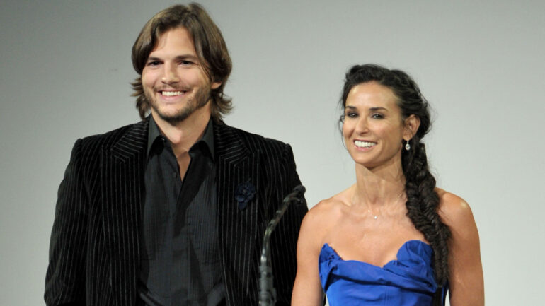 Actors Ashton Kutcher (L) and Demi Moore speak onstage at the 13th Annual Costume Designers Guild Awards with presenting sponsor Lacoste