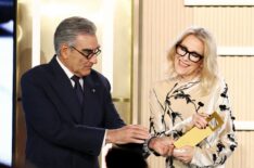 Honoree Catherine O'Hara (R) accepts the TIFF Norman Jewison Career Achievement Award from Eugene Levy (L) onstage at the TIFF Tribute Awards during the 2025 Toronto International Film Festival at The Fairmont Royal York Hotel on September 07, 2025