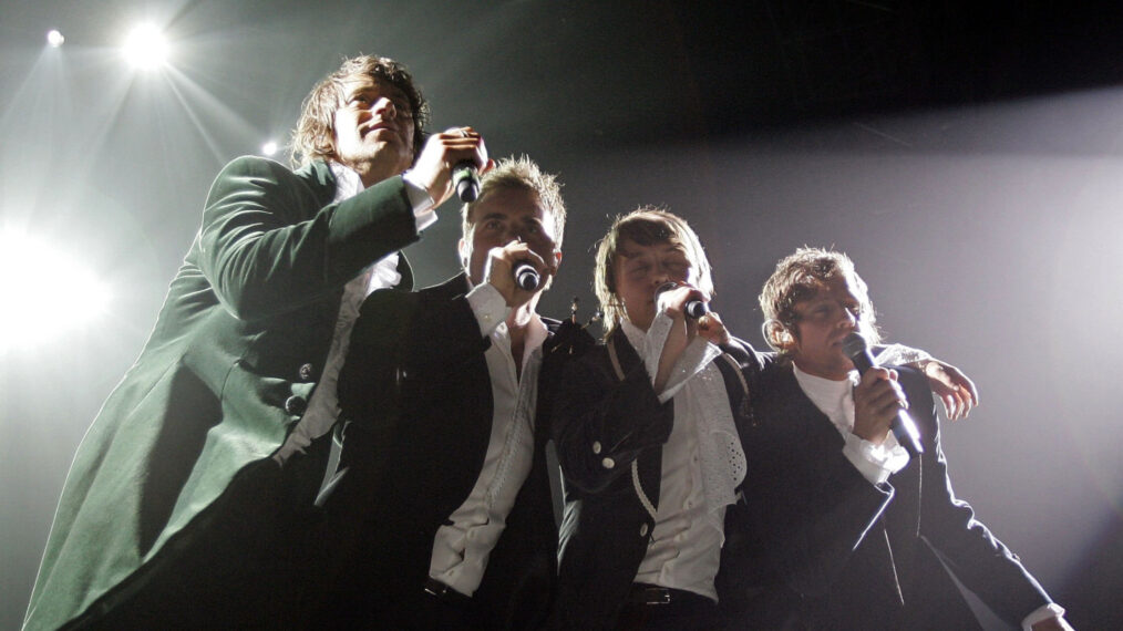 Howard Donald, Gary Barlow, Mark Owen, and Jason Orange of Take That perform on stage as part of the band's Ultimate Tour 2006 at Manchester Arena on May 4, 2006, in Manchester, England