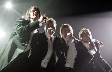 Howard Donald, Gary Barlow, Mark Owen, and Jason Orange of Take That perform on stage as part of the band's Ultimate Tour 2006 at Manchester Arena on May 4, 2006, in Manchester, England