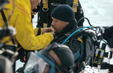 Will Smith prepares to dive under the ice with Dr. Allison Fong to collect samples in the waters of the North Pole