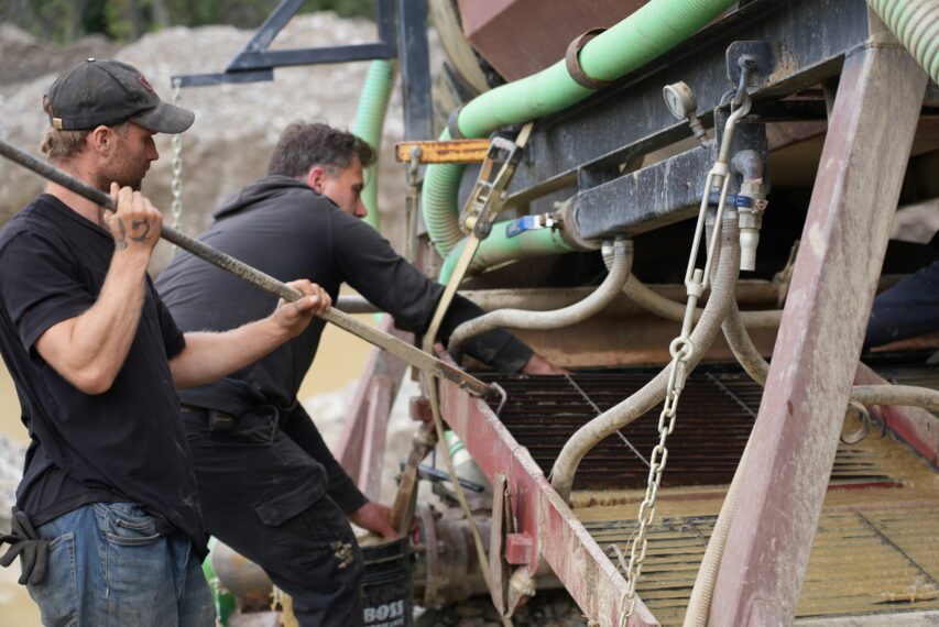 Morgan Fraughton and Simon removing expanded metal from washplant sluice