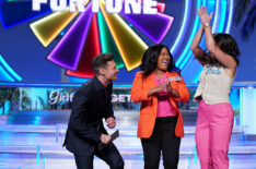 'Wheel of Fortune' contestant clapping with Ryan Seacrest
