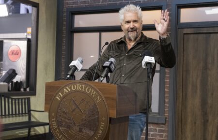 Guy Fieri at the mayor's podium in 'Flavortown Food Fight,' Season 1, Food Network, 2026.