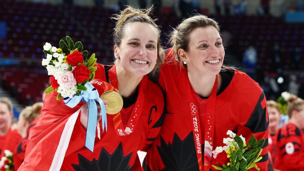 Marie-Philip Poulin #29 and Laura Stacey #7 of Team Canada celebrate during the medal ceremony after the Women's Ice Hockey Gold Medal match between Team Canada and Team United States on Day 13 of the Beijing 2022 Winter Olympic Games at Wukesong Sports Centre on February 17, 2022 in Beijing, China