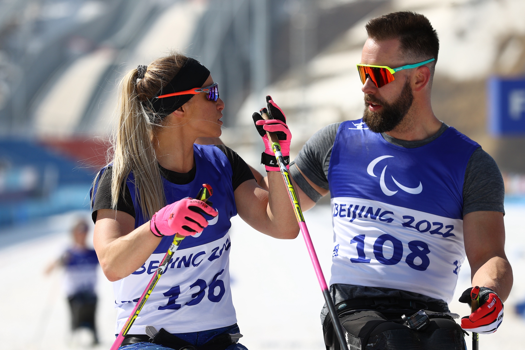 Oksana Masters of Team United States talks to Aaron Pike of Team United States following in the Middle Distance Sitting finals on day eight of the Beijing 2022 Winter Paralympics at Zhangjiakou National Biathlon Centre on March 12, 2022 in Zhangjiakou, China.
