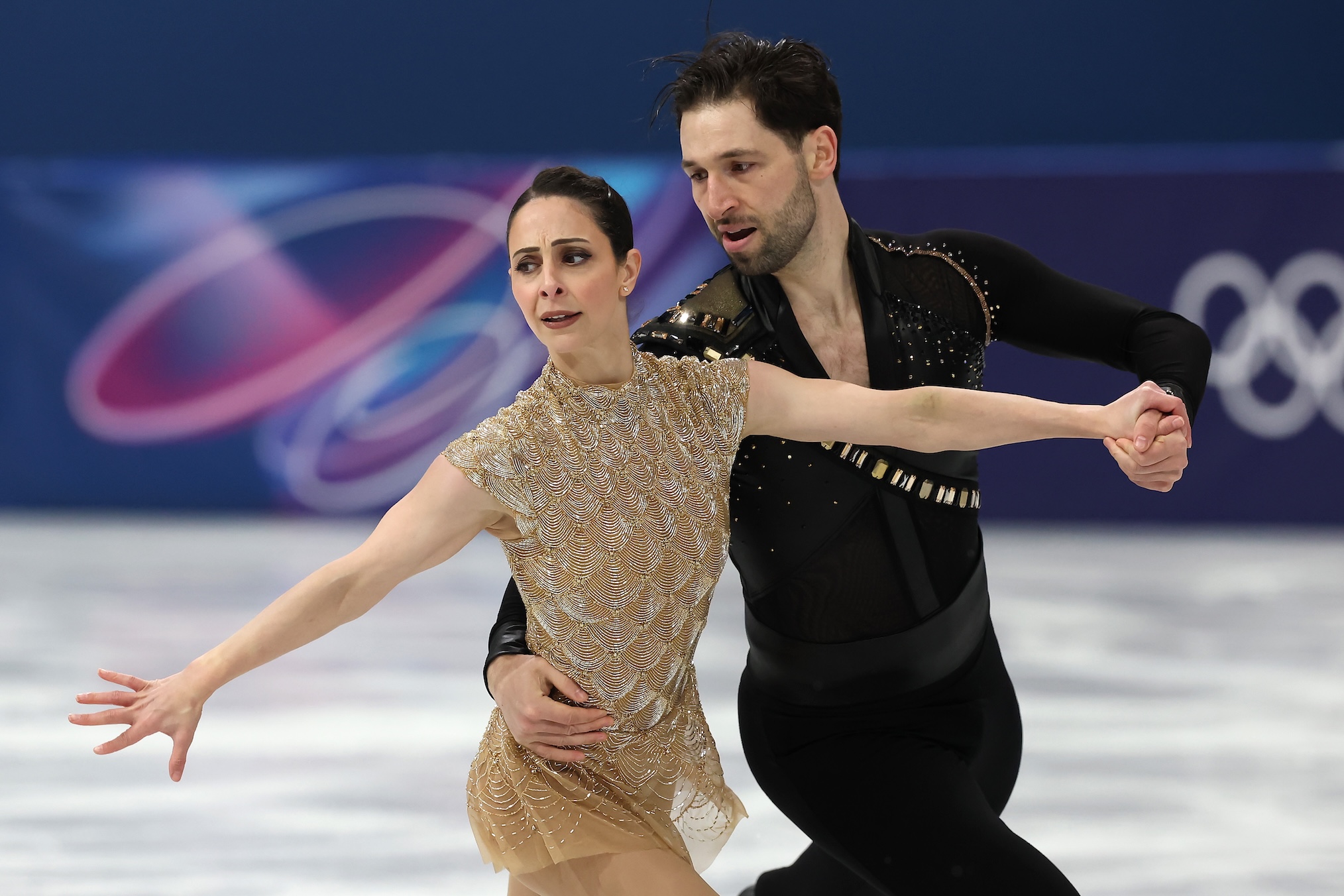 Deanna Stellato-Dudek and partner Maxime Deschamps of Team Canada compete in Pair Skating - Short Program on day nine of the Milano Cortina 2026 Winter Olympic games at Milano Ice Skating Arena on February 15, 2026 in Milan, Italy