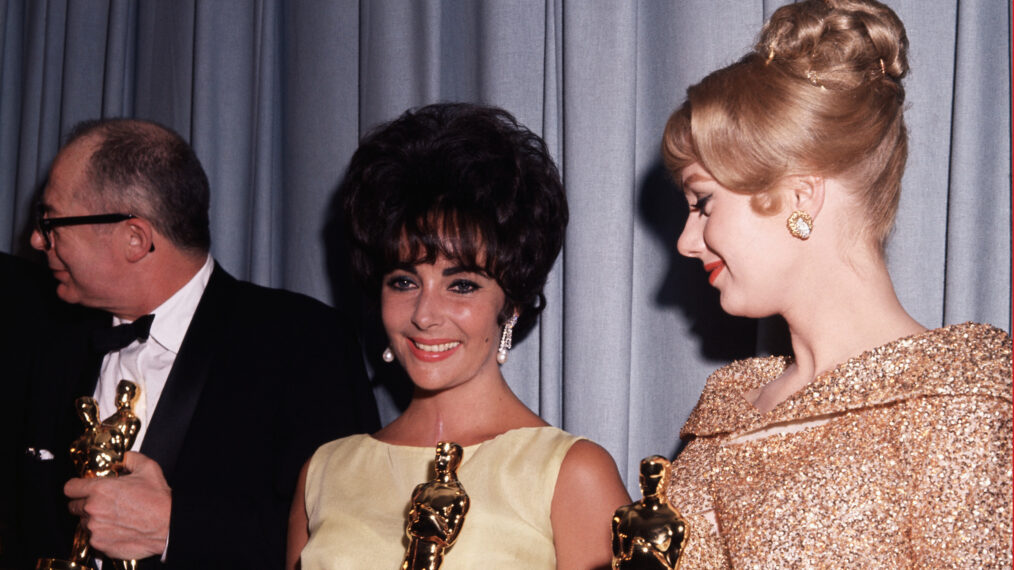 Burt Lancaster, Liz Taylor, winners of Best Actor and Actress Awards, holding their Oscars. Also with them is Shirley Jones, winner of the Best Supporting Actress Oscar. (Original Caption) 4/1961- Los Angeles, CA: