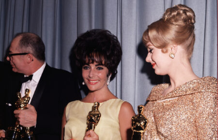 Burt Lancaster, Liz Taylor, winners of Best Actor and Actress Awards, holding their Oscars. Also with them is Shirley Jones, winner of the Best Supporting Actress Oscar. (Original Caption) 4/1961- Los Angeles, CA: