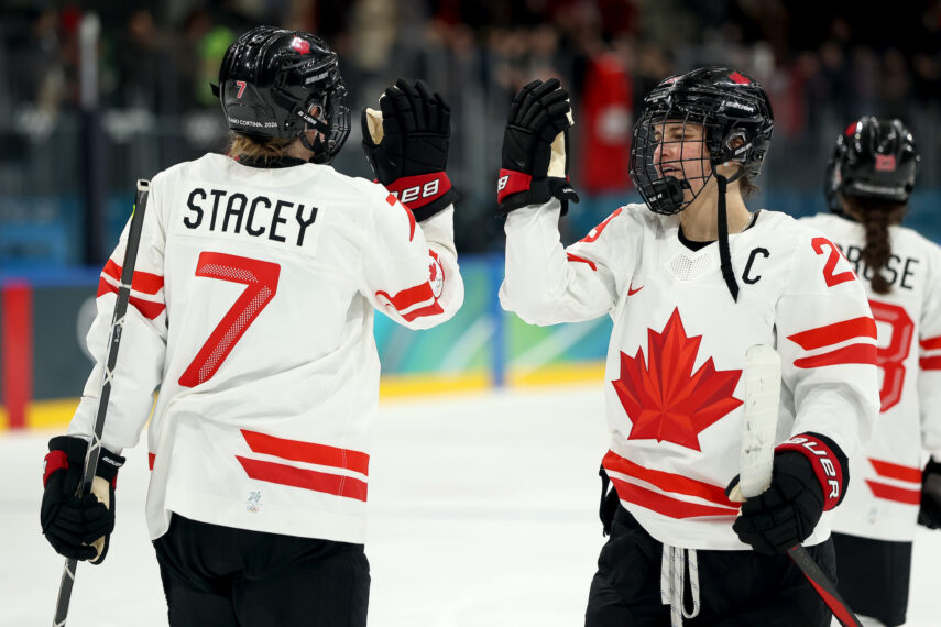 Laura Stacey #7 and Marie-Philip Poulin #29 of Team Canada celebrate after defeating Switzerland 4-0 in the Women's Preliminary Round Group A match between Canada and Switzerland on day one of the Milano Cortina 2026 Winter Olympic games at Milano Rho Ice Hockey Arena on February 07, 2026 in Milan, Italy.