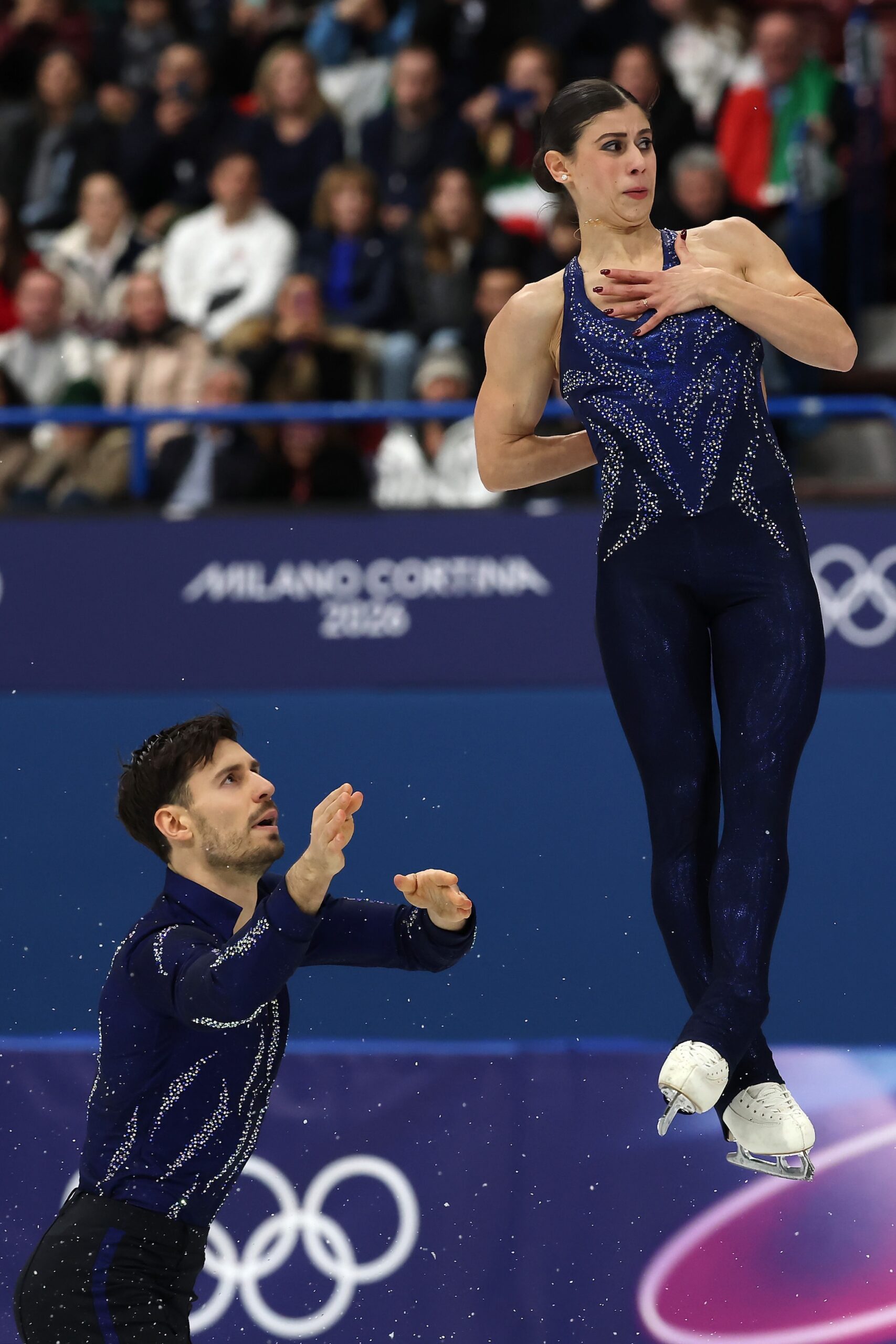 Rebecca Ghilardi and partner Filippo Ambrosini of Team Italy compete in Pair Skating - Short Program on day nine of the Milano Cortina 2026 Winter Olympic games at Milano Ice Skating Arena on February 15, 2026 in Milan, Italy.