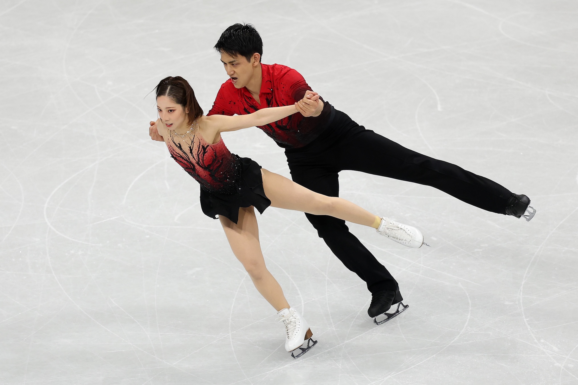 Riku Miura and partner Ryuichi Kihara of Team Japan compete in Pair Skating - Short Program on day nine of the Milano Cortina 2026 Winter Olympic games at Milano Ice Skating Arena on February 15, 2026 in Milan, Italy.
