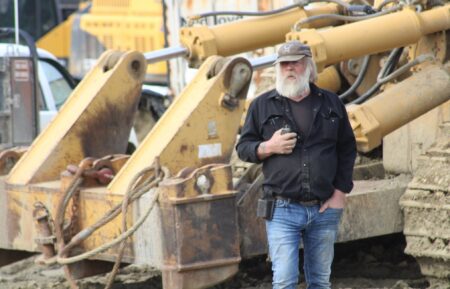 Tony Beets stood in front of machinery