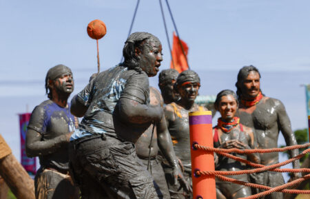 Cirie Fields competes in 'Survivor 50' premiere challenge, with Christian Hubicki, Cirie Fields, Jenna Lewis-Dougherty, Savannah Louie, and Ozzy Lusth watching behind her