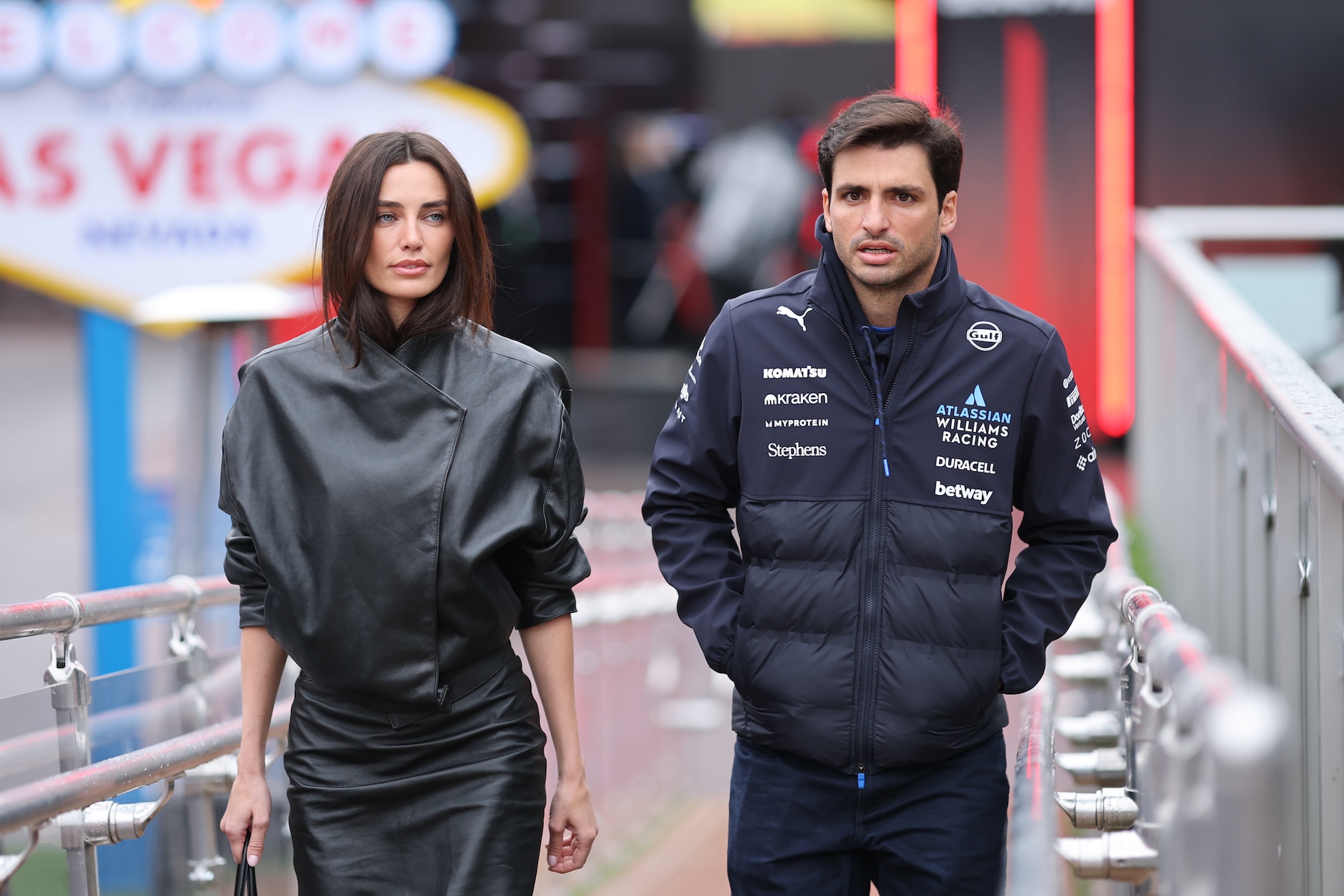 Rebecca Donaldson and Carlos Sainz of Spain and Williams arrives in the Paddock prior to final practice ahead of the F1 Grand Prix of Las Vegas at Las Vegas Strip Circuit on November 21, 2025 in Las Vegas, Nevada.