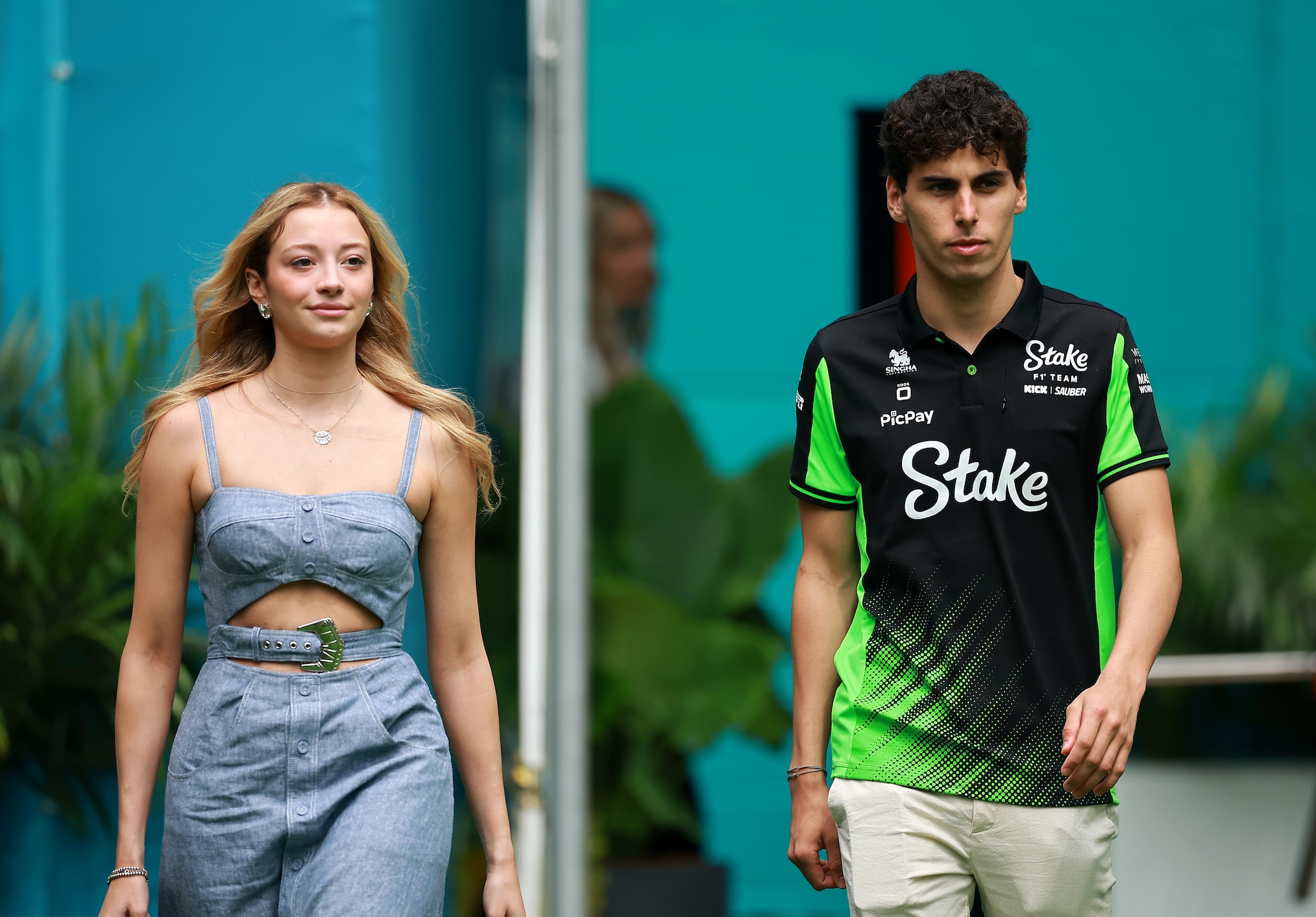 Gabriel Bortoleto of Brazil and Stake F1 Team Kick Sauber and Isabella Bernardini arrive in the Paddock prior to the F1 Grand Prix of Miami at Miami International Autodrome on May 04, 2025 in Miami, Florida.
