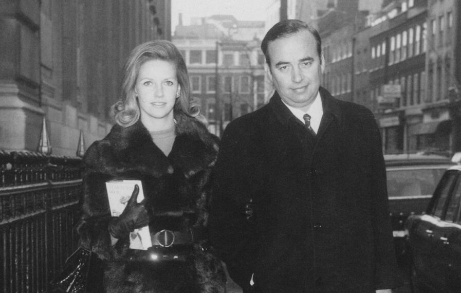 Australian media mogul Rupert Murdoch arriving at the Connaught Rooms, London, with his second wife Anna Torv, for a meeting of shareholders in the News Of The World newspaper, 2nd January 1969. The shareholders are to vote on whether to accept a share exchange deal with Murdoch's company, News Ltd, or approve a 34 million pound takeover bid by Pergamon Press, owned by rival publisher Robert Maxwell. The vote later went in favour of Murdoch's offer.