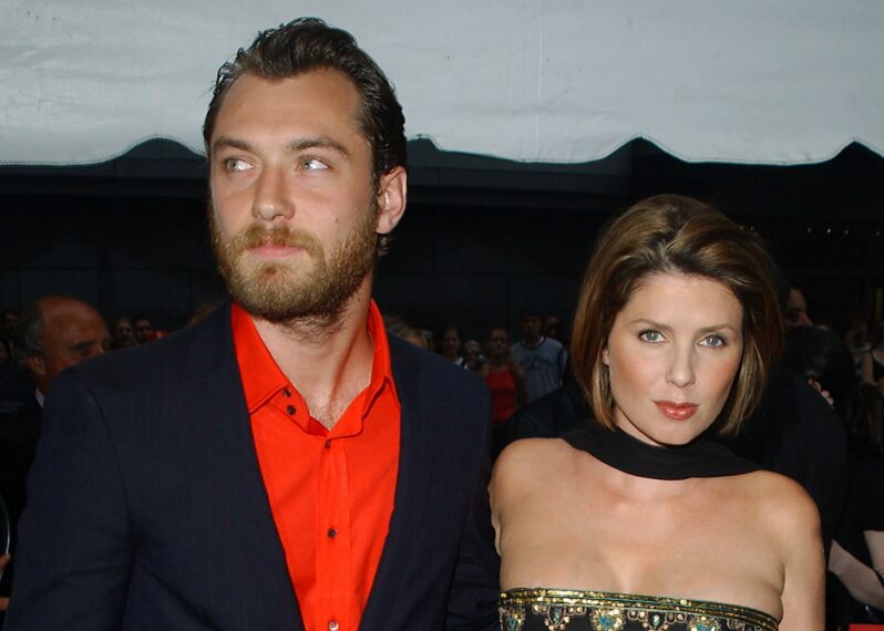 Actor Jude Law arrives with his wife Sadie Frost for the "Road To Perdition" film premiere July 9, 2002 at the Ziegfeld Theater in New York City.
